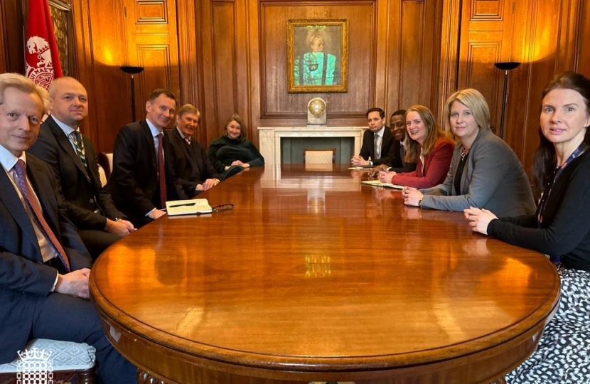 Katherine Fletcher sat at a table with an umber of other MPs, opposite the Chancellor, Jeremy Hunt