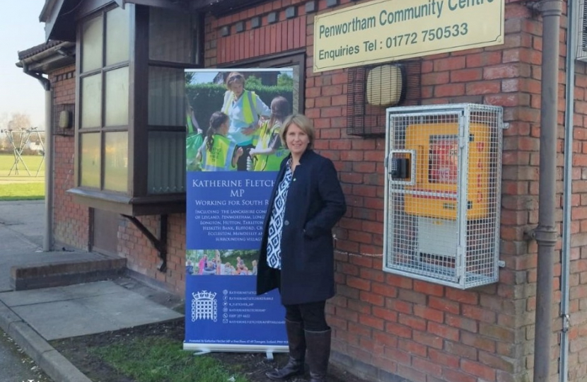 Katherine Fletcher stood outside Penwortham Community Centre with a banner advertising surgeries.