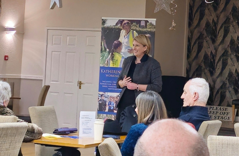 Katherine talking to a group of people