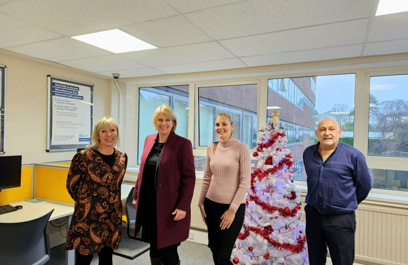 Katherine with Sam, Karl and Rachael from DWP. Christmas tree behind.