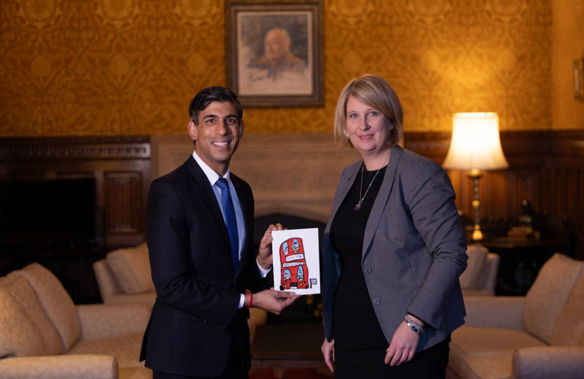 Katherine giving Christmas card to Rishi Sunak