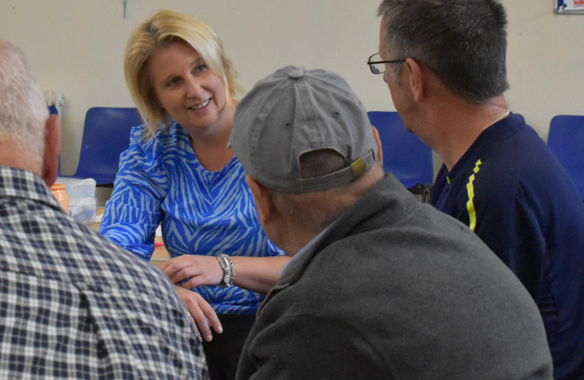 Katherine talking to people at a dementia cafe