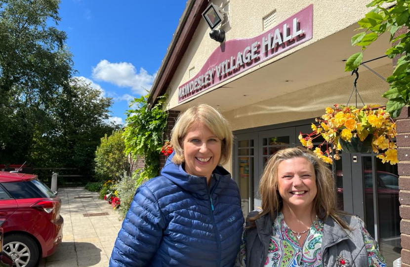 Katherine standing outside Mawdesley Village Hall with another lady