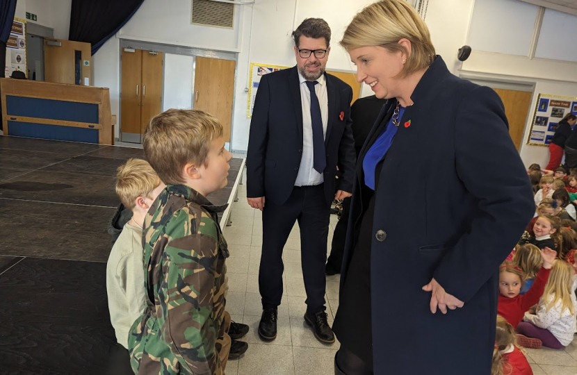 Katherine talking to a boy in a soldier outfit