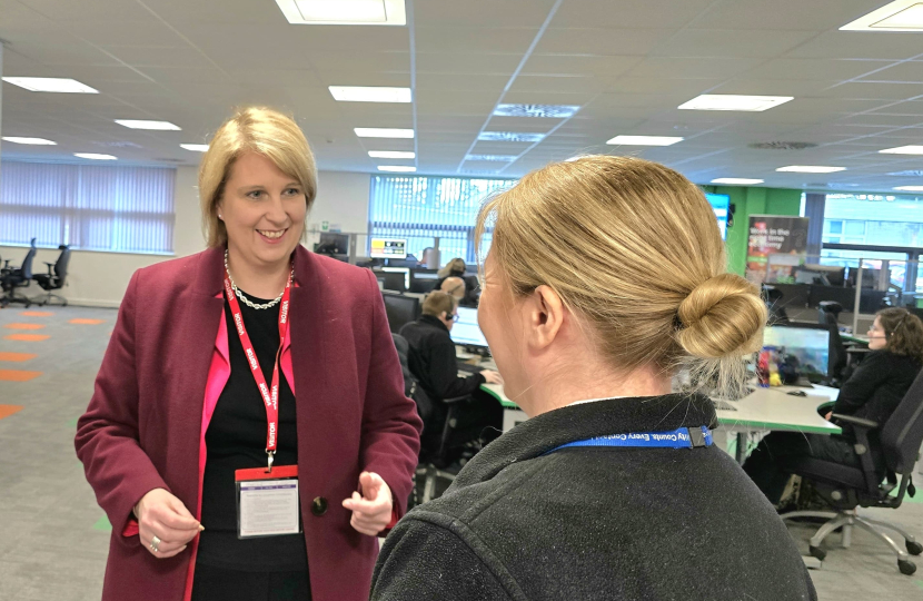 Katherine talking to a member of staff in the police control room