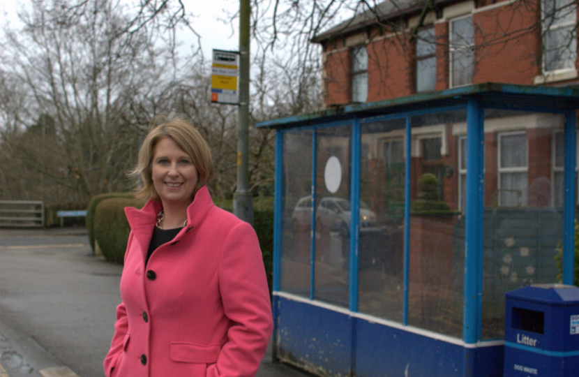 Katherine standing at a bus stop