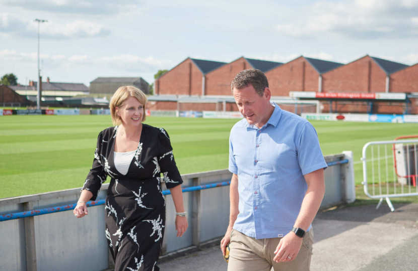 Katherine chatting to a man at Lancashire FA 