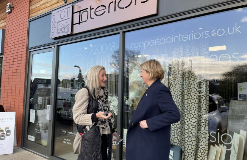 Katherine outside Coppertop Interiors talking to another woman