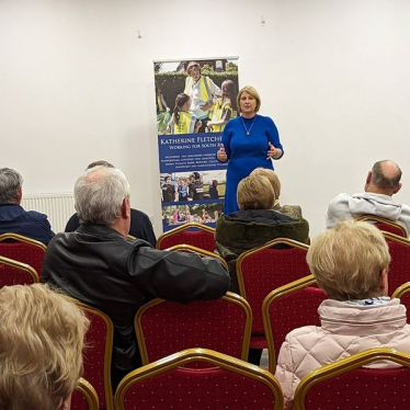 Katherine talking to a group of people