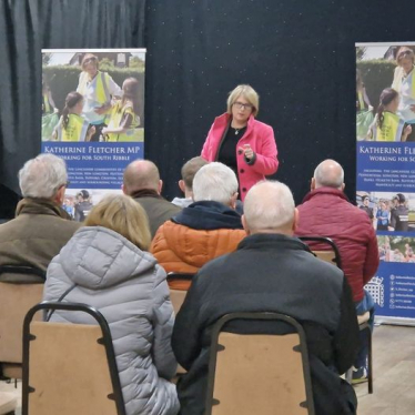 Katherine talking to a group of people