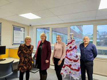 Katherine with Sam, Karl and Rachael from DWP. Christmas tree behind.