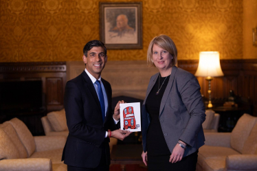 Katherine giving Christmas card to Rishi Sunak