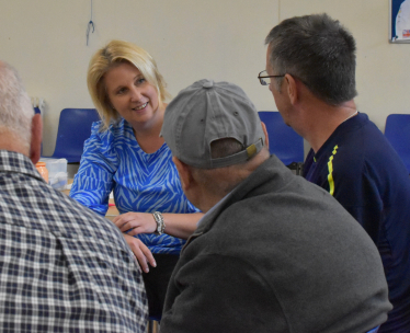 Katherine talking to people at a dementia cafe