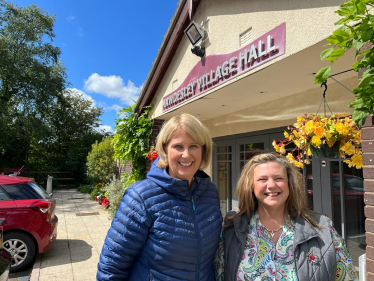 Katherine standing outside Mawdesley Village Hall with another lady