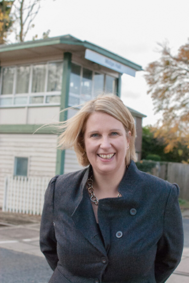 Katherine standing in front of Midge Hall Station