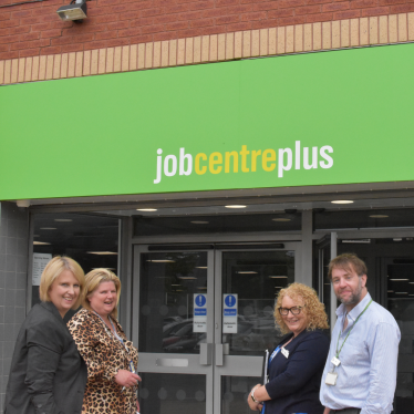 Katherine outside Preston job centre with members of staff
