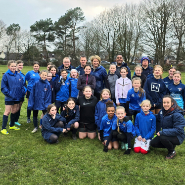 Katherine with the girls and their coaches