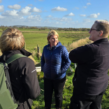 Katherine talking to two other people at the site