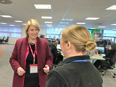 Katherine talking to a member of staff in the police control room