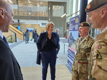 Katherine talking to military staff