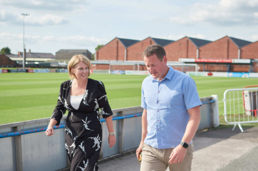 Katherine chatting to a man at Lancashire FA 