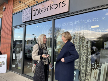 Katherine outside Coppertop Interiors talking to another woman